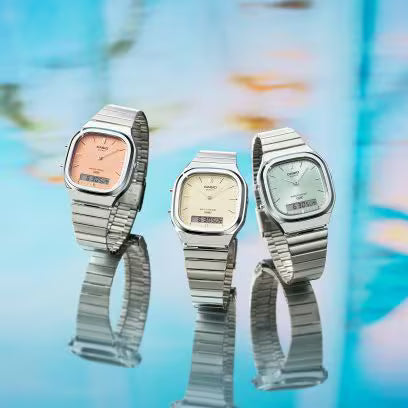 Reloj Análogo Digital Clásico Plateado con Naranja Unisex